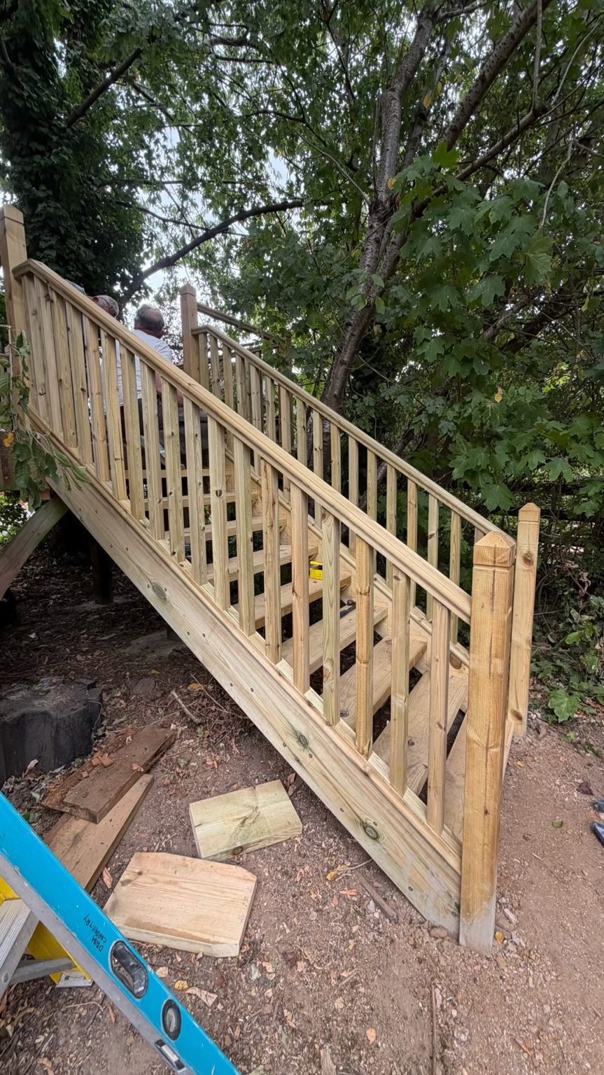 Outdoor timber staircase and handrail under construction